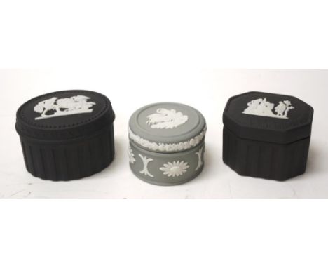 Three Wedgwood jasperware Romanesque trinket boxes comprising 2 black basalt and 1 green jasperware, in original boxes