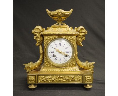 Good French gilt mantel clock with enamel dial, goat head decoration and cornucopia. Striking on a bell. Marked Popon a Paris