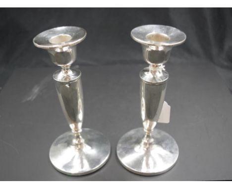 Pair George V sterling silver candlesticks Birmingham 1920, maker I.M. Hutchfield, weighted bases, (height 17cm approx, each)