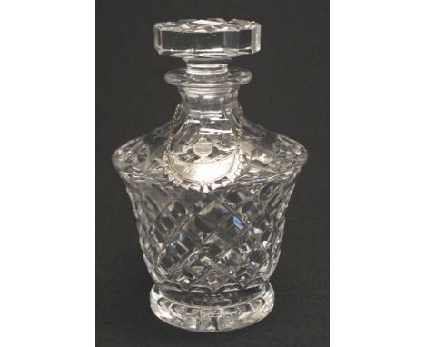 Heavy cut crystal whisky decanter with sterling silver label