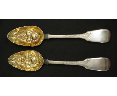 Pair George IV sterling silver berry spoons London 1822, maker William Eaton, each with embossed gilt washed bowls, (weight 1