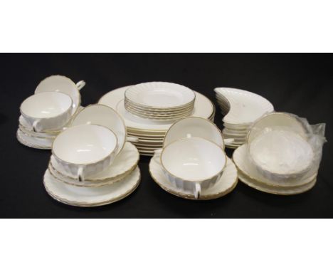 Quantity of similar Royal Worcester dinner ware all white with gilt rim decoration, comprising 8 soup coups and under saucers