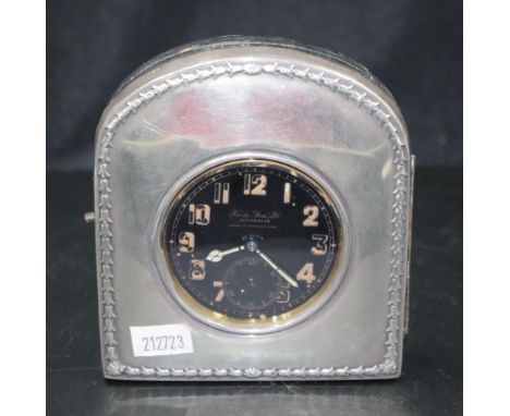 Early 20th century 8 day Goliath travelling clock Hardy Bros.Ltd, with a sterling silver hallmarked Chester year rubbed easel