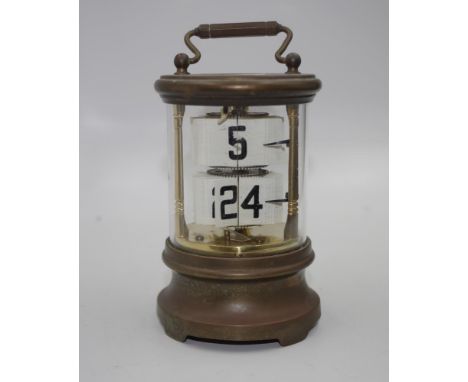Brass cased ticket clock with wind up movement, 16cm high approx (handle up)