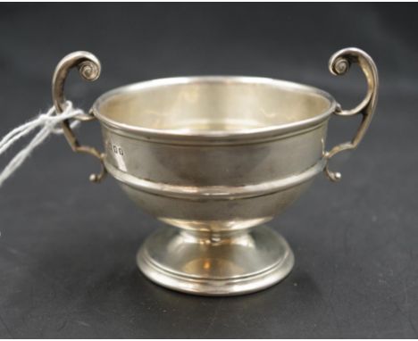 George V sterling silver small footed bowl London 1933, makers Kemp Brothers, dual handles, footed base, (diameter 9cm; weigh