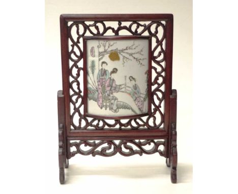 Chinese painted ceramic tile in carved wood stand ceramic tile, with painted figural decoration, inset to a fitted carved woo