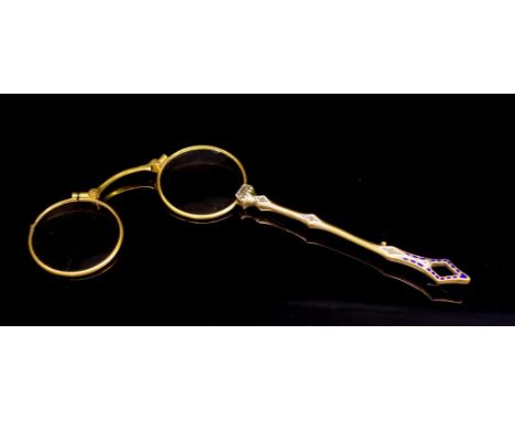 Antique long handle gilt metal lorgnette with enamel highlights.