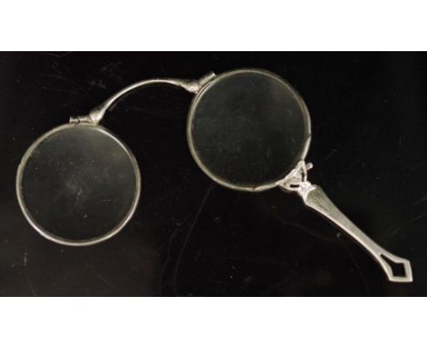 Silver lorgnette with plain deco handle well used.