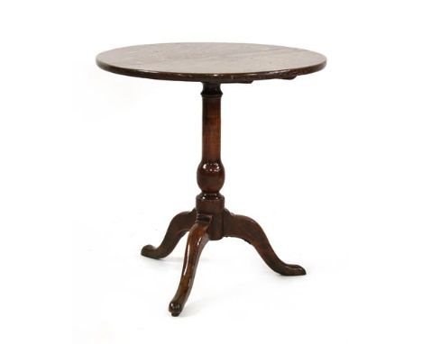 A tripod table, with an oak top and fruitwood base, both parts 18th century, a marriage, 64cm diameter, 85cm high Provenance: