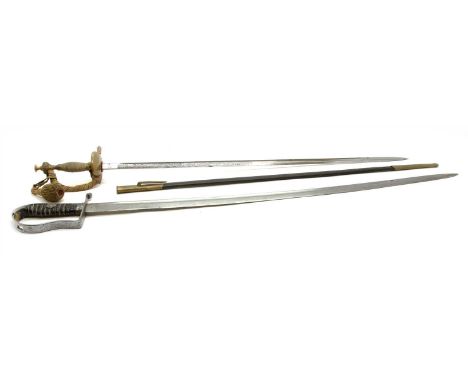 Two swords, including a 1769 style light cavalry sabre , (probably German) and a German dress sword with etched blade and pom