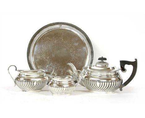 A silver three piece tea service , by Viner's Ltd, Sheffield 1956, with half fluted decoration, total weight approximately 37