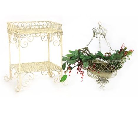 A modern wrought iron two-tier table, 47 cm square, 66 cm high and a hanging wirework planter, 60 cm high Provenance: The Bet