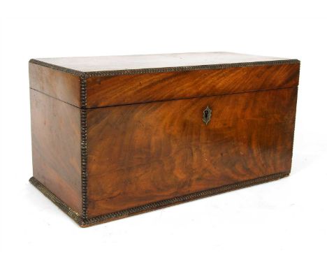 A George III mahogany tea caddy with toothed edging, the interior complete with cut glass mixing bowl, 36 cm wide x 18.5 cm d