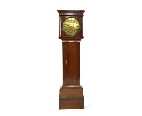 A George III oak Longcase clock, by Sutton of Stafford, with a circular 12” brass dial, an eight day movement and fluted cant