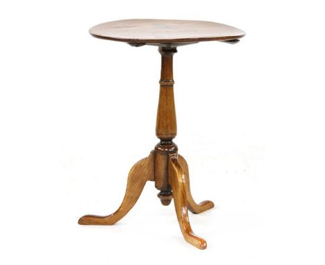 A George III tripod table, with a circular cherry wood top and legs, and a pine baluster support, 44cm diameter, 59cm high Pr