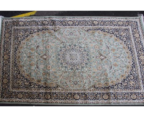 A green ground Kashan carpet, 230 x 160cm