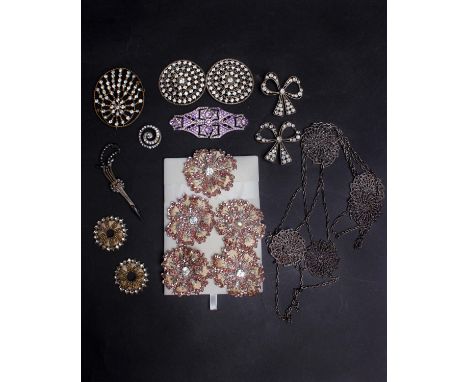 A collection of late 19th and early 20th Century paste and cut steel items, including bow shaped dress ornaments, a buckle, b