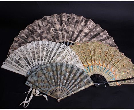 A late 19th Century Brussels lace fan within a silk box, the mother of pearl sticks and guards decorated with trailing flower