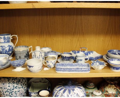 A collection of blue and white pottery and porcelain to include willow pattern and Spode. 