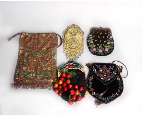 A late 19th Century black velvet evening bag, decorated with colourful floss silk embroidery, a 19th Century glass beaded dra