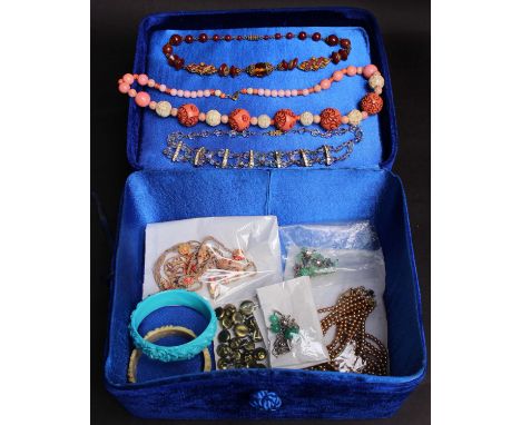 A collection of costume jewellery; comprising four carved plastic bangles, 1920s and 1930s glass bead necklaces, an early pla