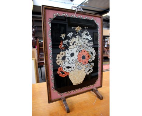 A 1920s framed advertising print for Partners Port and a 1930s wooden fire screen with foil decoration (2)