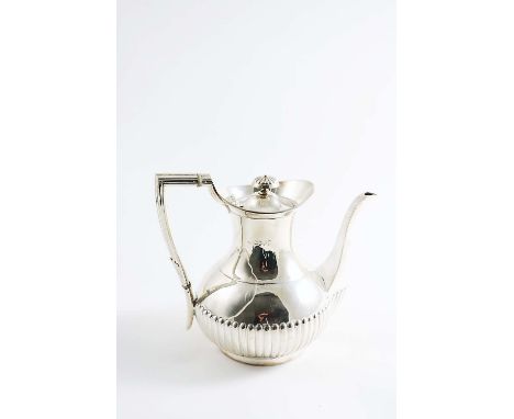 A LATE VICTORIAN COFFEE POT with a part-fluted, circular body, a waisted neck and an angular reeded handle, by Edward Hutton,