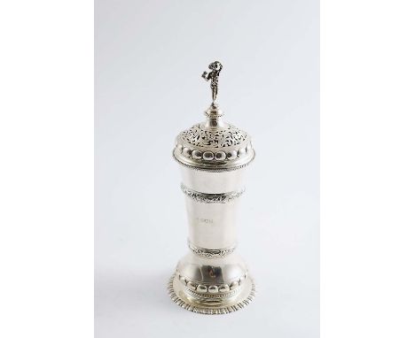 AN EDWARDIAN SUGAR CASTER resembling a covered beaker with a figure finial, by J. Wakely & F.C. Wheeler, London 19.8"  (25 cm