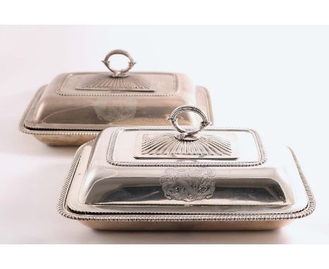 BY PAUL STORR:- A set of four George III entree dishes and covers of rectangular cushion form with rounded corners and gadroo