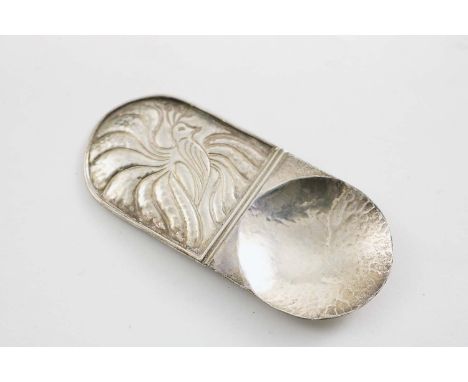 A CONTEMPORARY HANDMADE CADDY SPOON with a lug handle, chased with a stylised peacock, by Chris N. Morphy (of Shaftesbury, Do