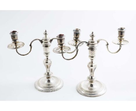 A PAIR OF LATE 20TH CENTURY CAST TWIN BRANCH CANDELABRA on circular bases with well centres, and octagonal baluster columns, 