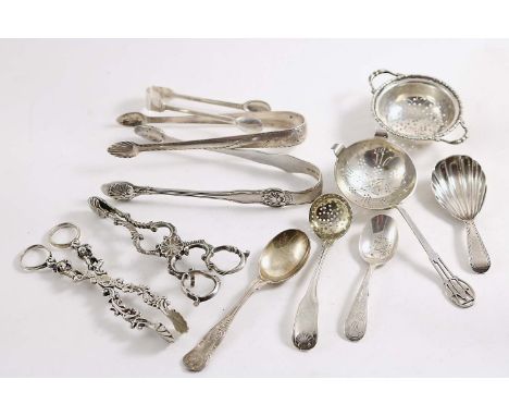 A PAIR OF GEORGE III IRISH BRIGHT-CUT SUGAR TONGS initialled, a pair of King's Husk pattern sugar tongs, crested, a small pai
