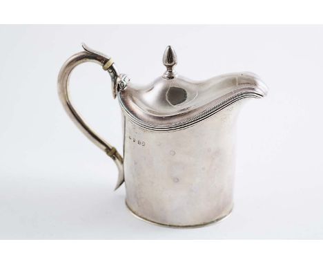 A GEORGE III SMALL HOT MILK JUG  with a plain oval body reeded border & a bud finial, engraved on the front with a crest, mot