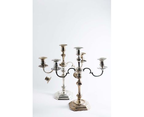 AN EDWARDIAN MATCHED PAIR OF THREE LIGHT CANDELABRA with scroll branches, spool-shaped capitals with detachable nozzles and c
