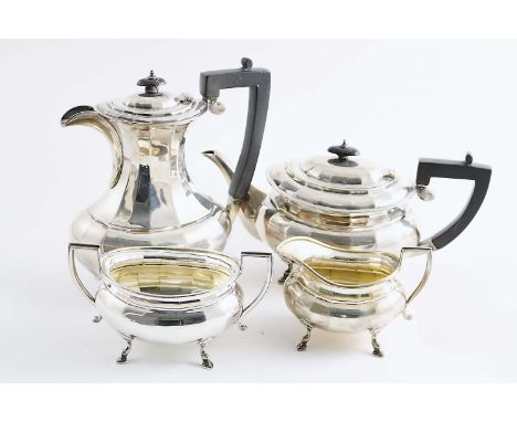 AN EARLY 20TH CENTURY FOUR-PIECE TEA SERVICE with faceted oval bodies and angular handles, maker's mark "JS", Sheffield 1926;