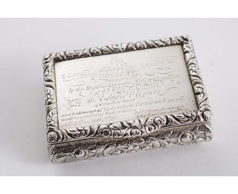A WILLIAM IV IRISH PRESENTATION SNUFF BOX rectangular with chased convex sides and a raised border & thumbpiece, the cover in