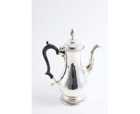 A LATE VICTORIAN COFFEE POT of baluster form with a domed cover, wrythen finial and gadrooned borders, by Henry Stratford, Lo