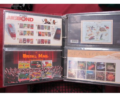 A Four Ring Binder of GB FDC's from 1972 to 1988, plus a collection of GB presentation packs with a mint decimal face value o