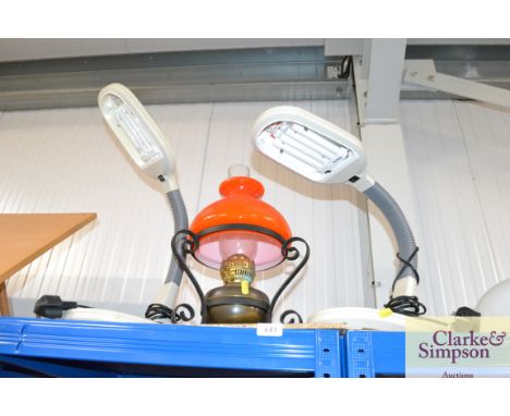 Two reading lights together with an oil lamp