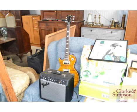 A vintage V100AFD Paradise Guitar with solid mahogany body and maple veneer, left handed together with a Fender frontman