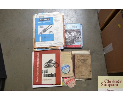 A collection of vintage vehicle documents; tax discs and other ephemera