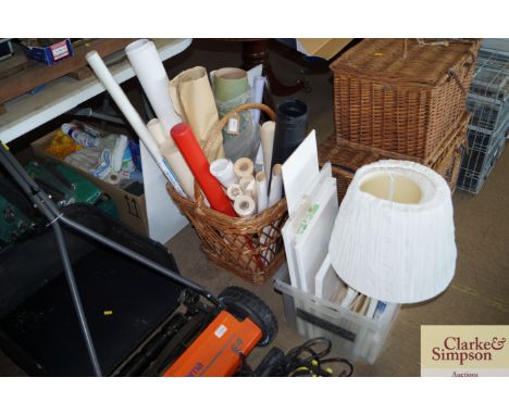 A wicker basket and contents of artists materials etc; a plastic box of unused and other artists materials, lamp shades etc. 