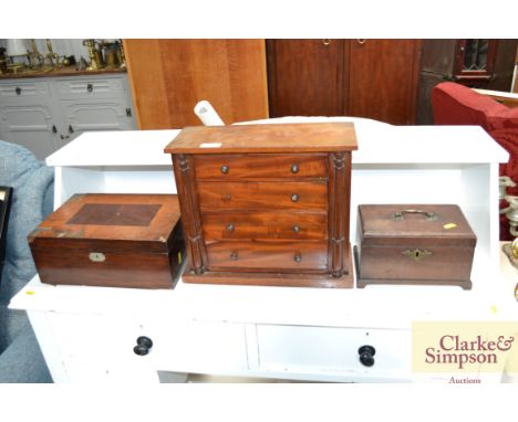 A miniature Victorian mahogany four drawer chest, a sewing box lacking fitments and an antique tea caddy