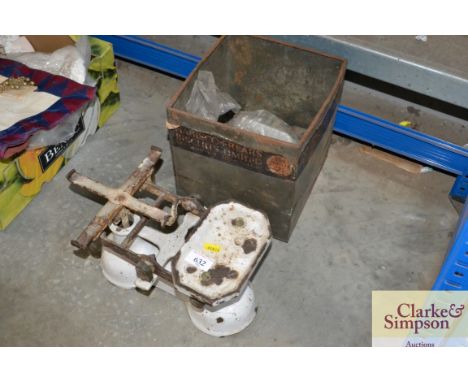 A set of kitchen scales and various weights