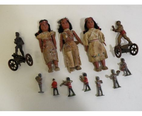 Group of vintage toys including lead soldiers featuring Charbens, three leather dolls and two tin plate clockwork boxers