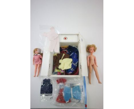 Quantity of vintage Sindy doll clothing plus two dolls including Ideal 1965 all in wardrobe
