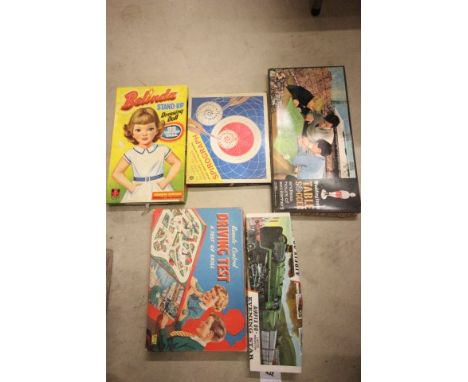 Group of vintage boxed games including boxed and sealed Airfix Evening Star model kit, Merit Remote Control Driving Test, Wad