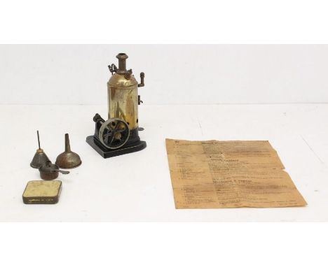 Engine: An early 20th century, German, vertical steam engine, with accessories, height approx. 8", with original instructions