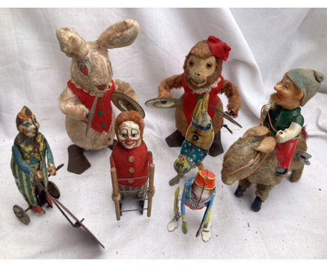 Tinplate: A collection of vintage tinplate clockwork figures to include Schuco clown with ladder, Elf like figure on Donkey, 