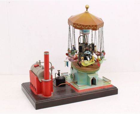 Live Steam: A horizontal live steam engine, together with a Swiss model of a carousel 'Thul Dampfkarussell', upon wooden base